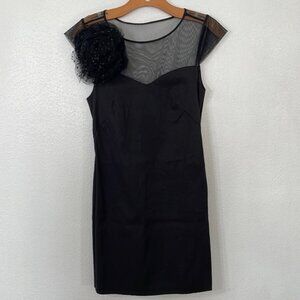 Pearl by Georgina Chapman of Marchesa black dress, mesh top, shoulder corsage